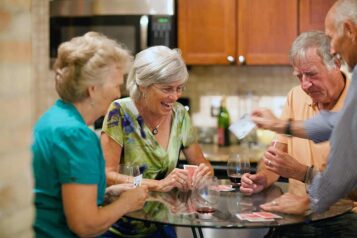 Independent seniors playing a card game together